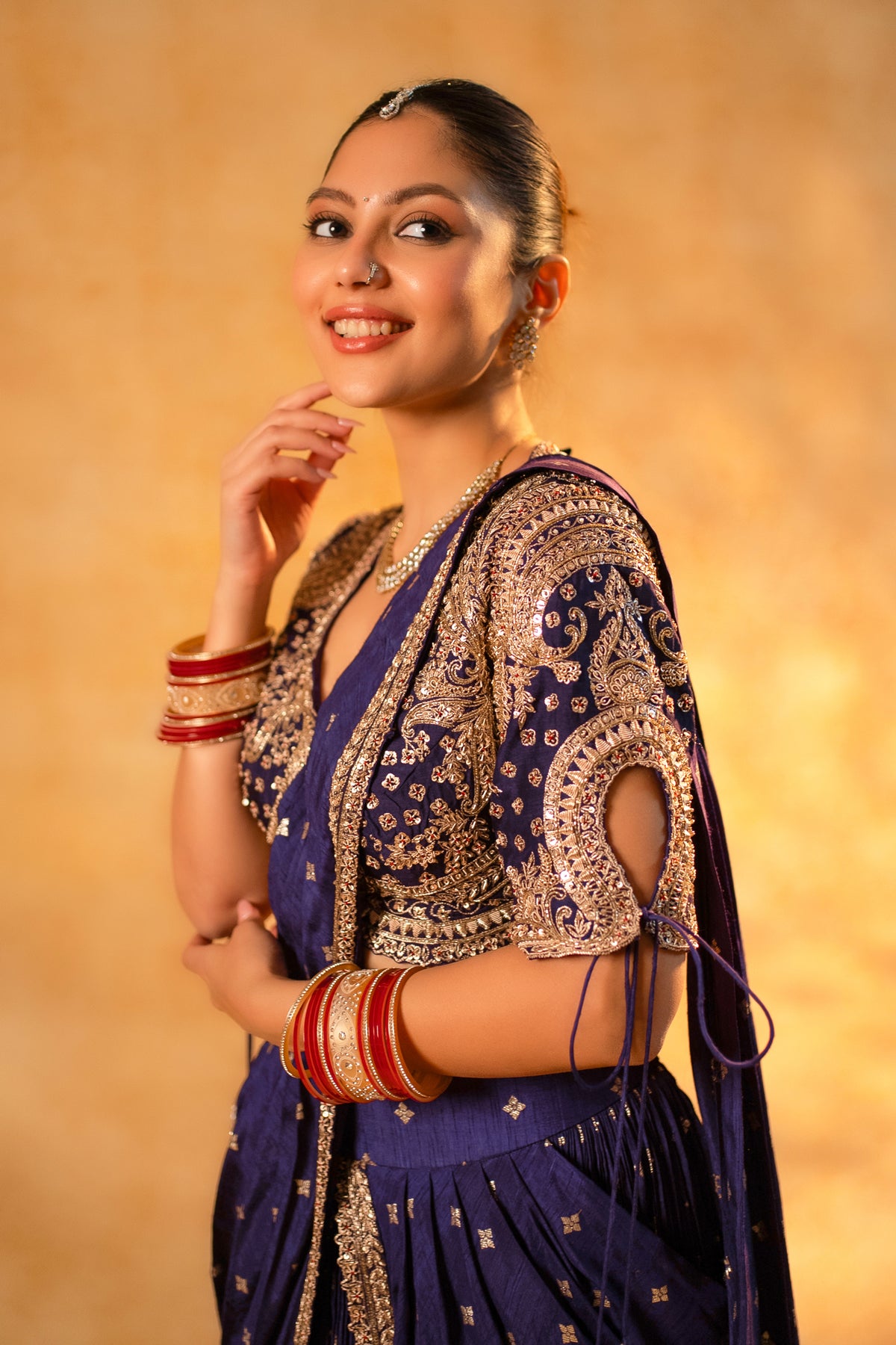 Imperial Plum Purple Raw Silk Saree highlighting the pre-stitched silhouette and hand-embroidered blouse