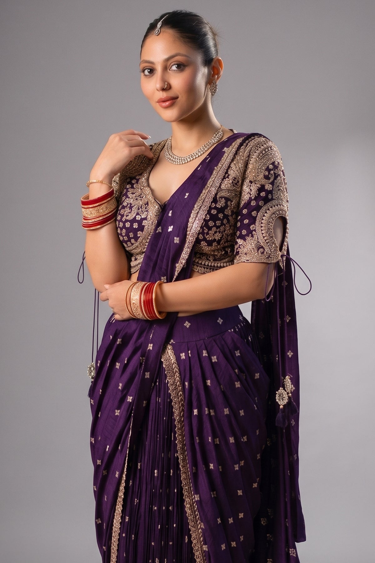 Close-up of the geometric butti weave and zari border on the Imperial Plum Purple Raw Silk Saree