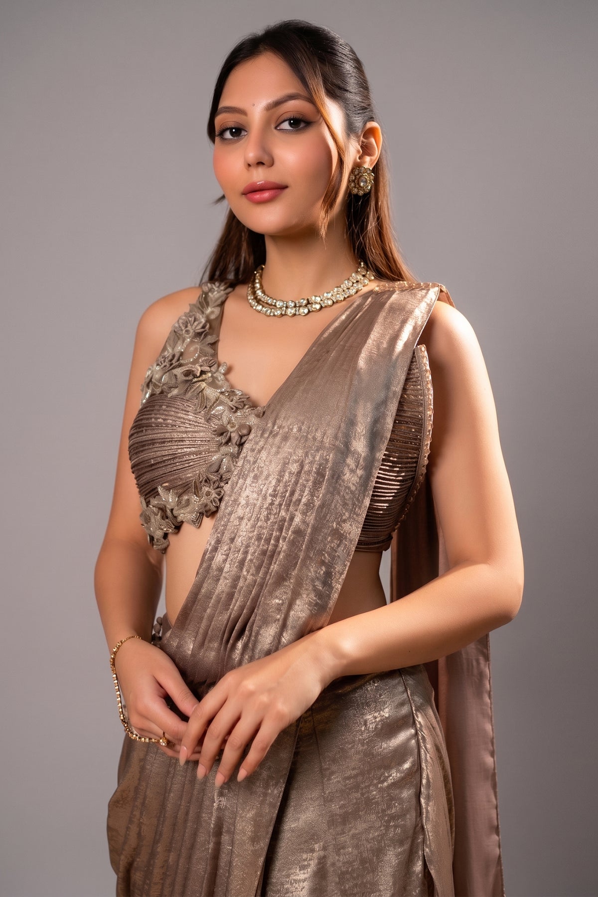 Close-up of intricate 3D floral motifs and cutdana work on the Champagne Beige Ready to Wear Saree
