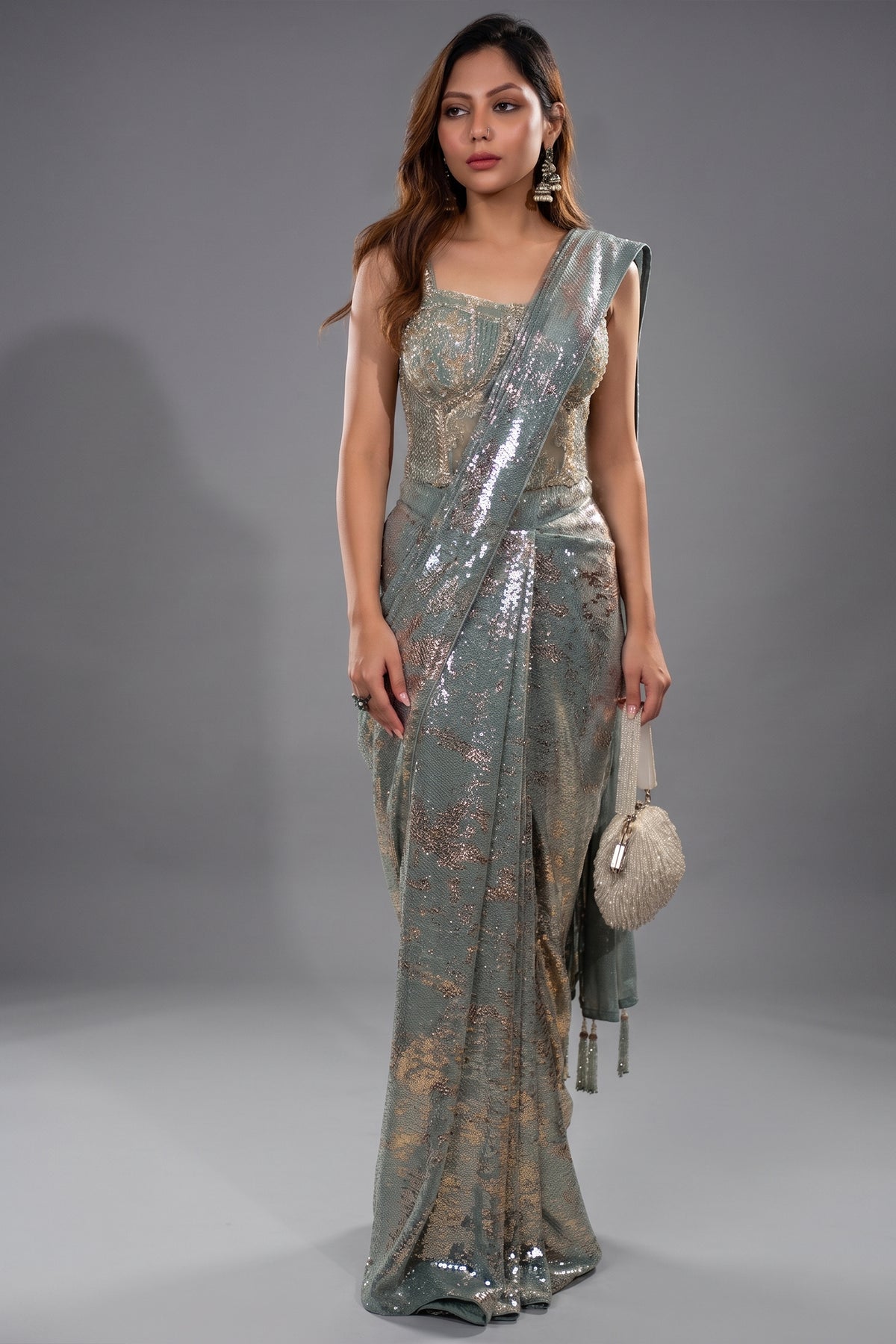 Close-up of tonal sequins and zardosi work on the Mint Blue Lycra Net Sequinned Saree