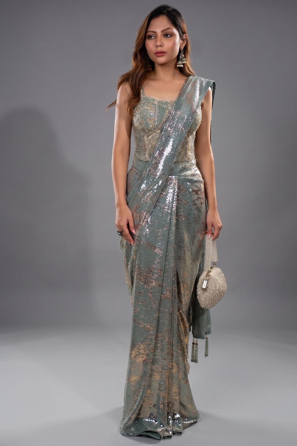 Close-up of tonal sequins and zardosi work on the Mint Blue Lycra Net Sequinned Saree