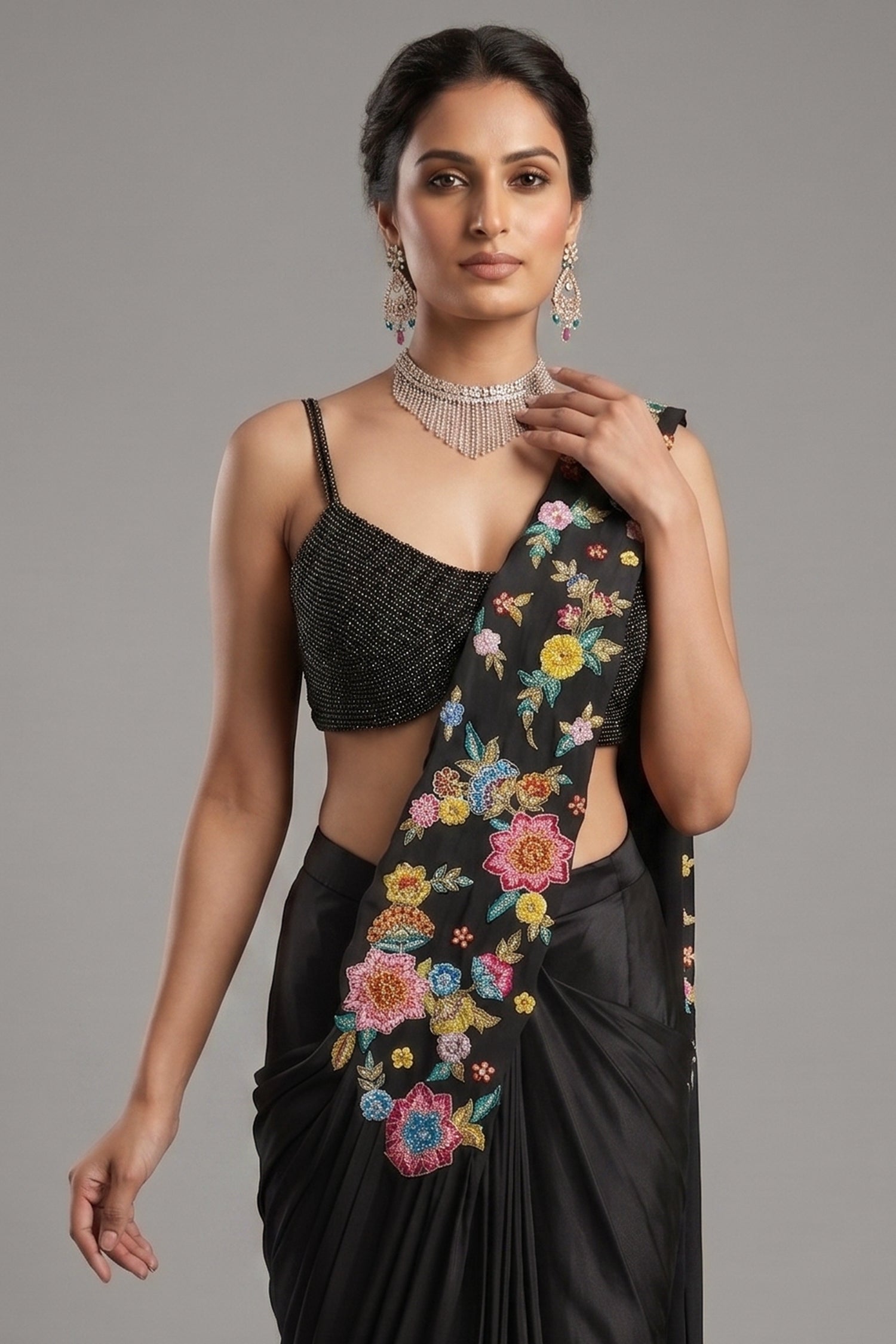 Close-up of intricate floral embroidery and shimmering sequins on the Black Crepe Satin Silk Floral Embroidered Readymade Saree