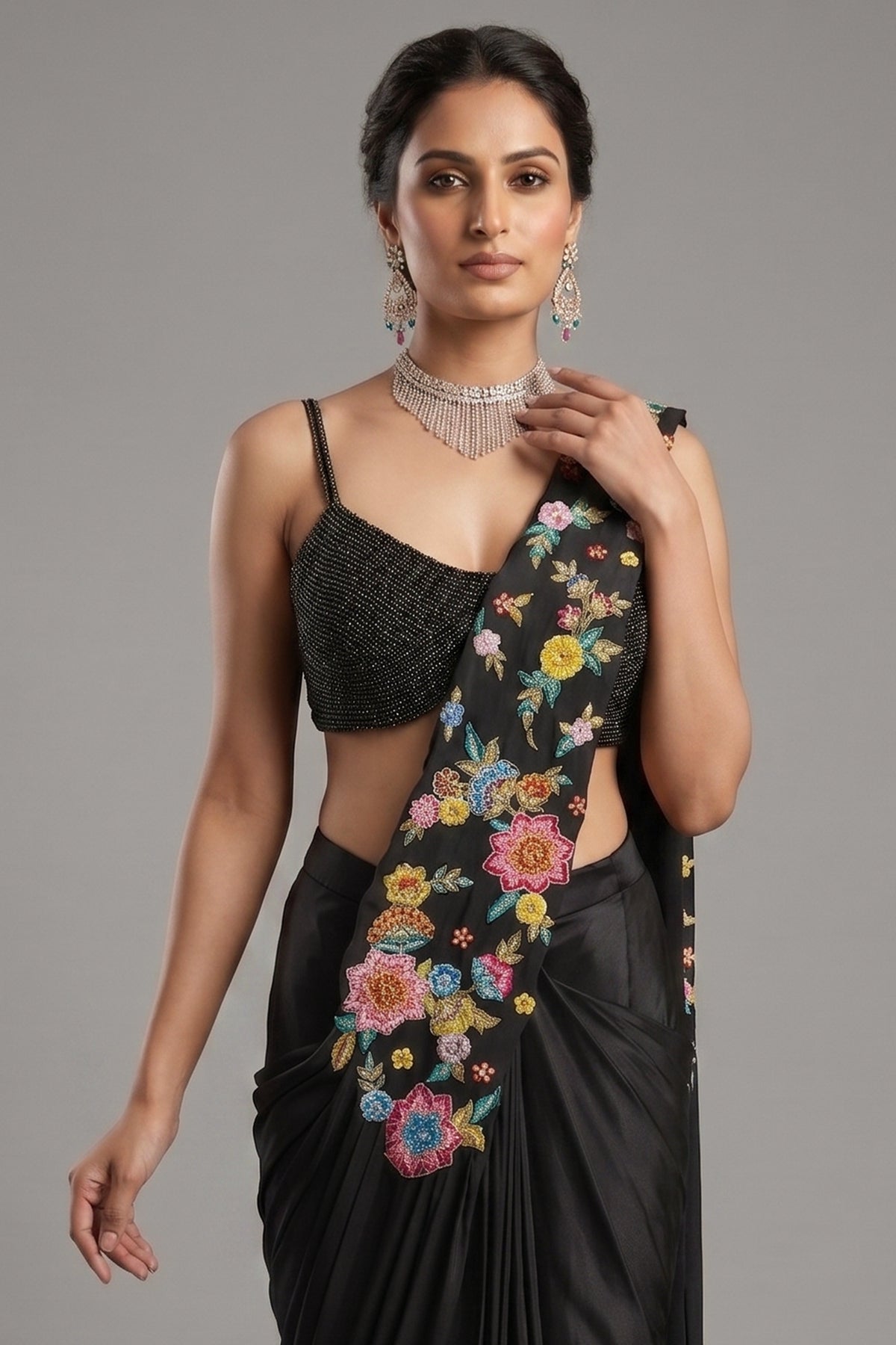 Close-up of intricate floral embroidery and shimmering sequins on the Black Crepe Satin Silk Floral Embroidered Readymade Saree