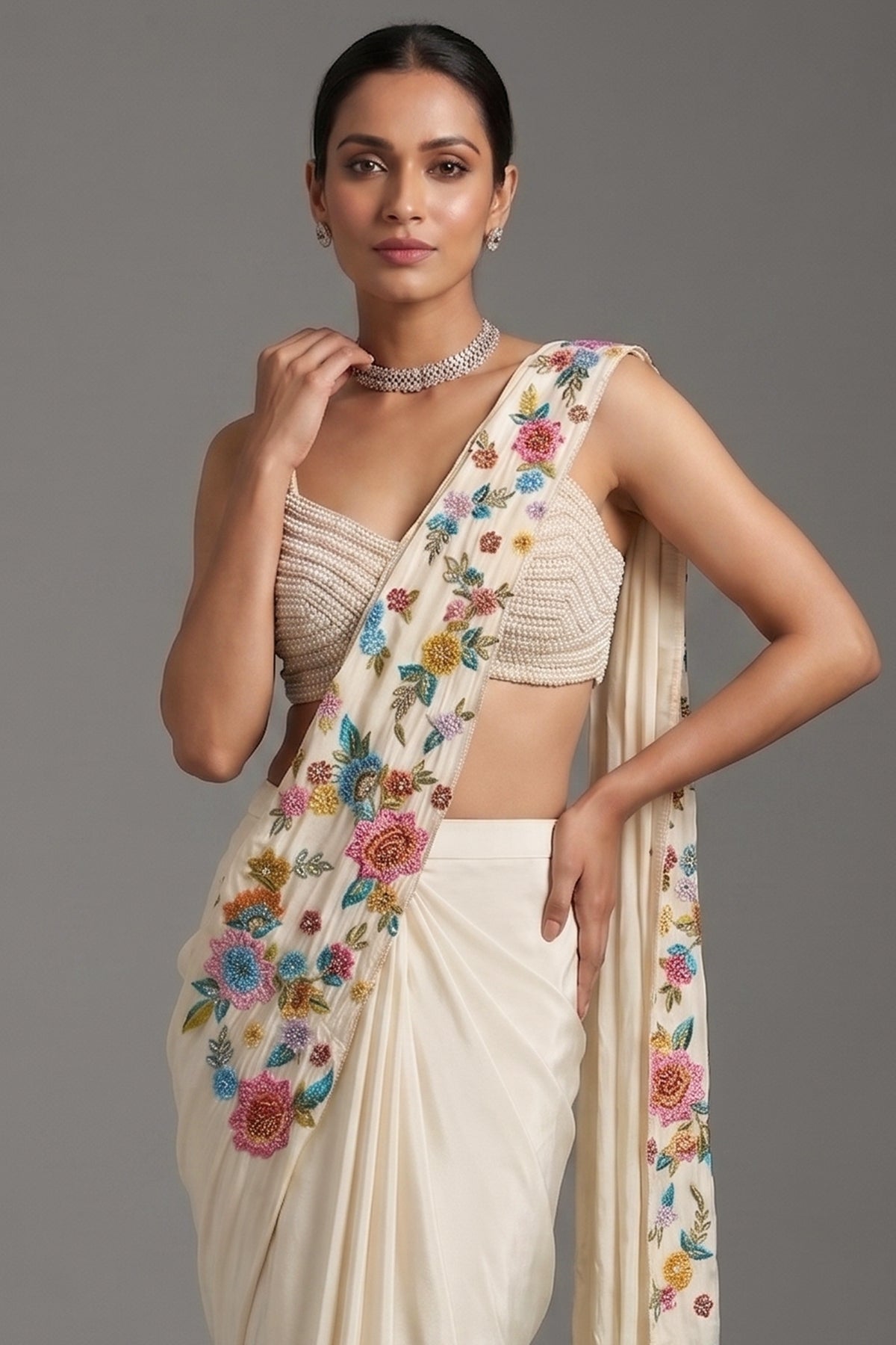 Close-up of vibrant floral embroidery and sequins on the Cream Crepe Satin Silk Floral Embroidered Readymade Saree