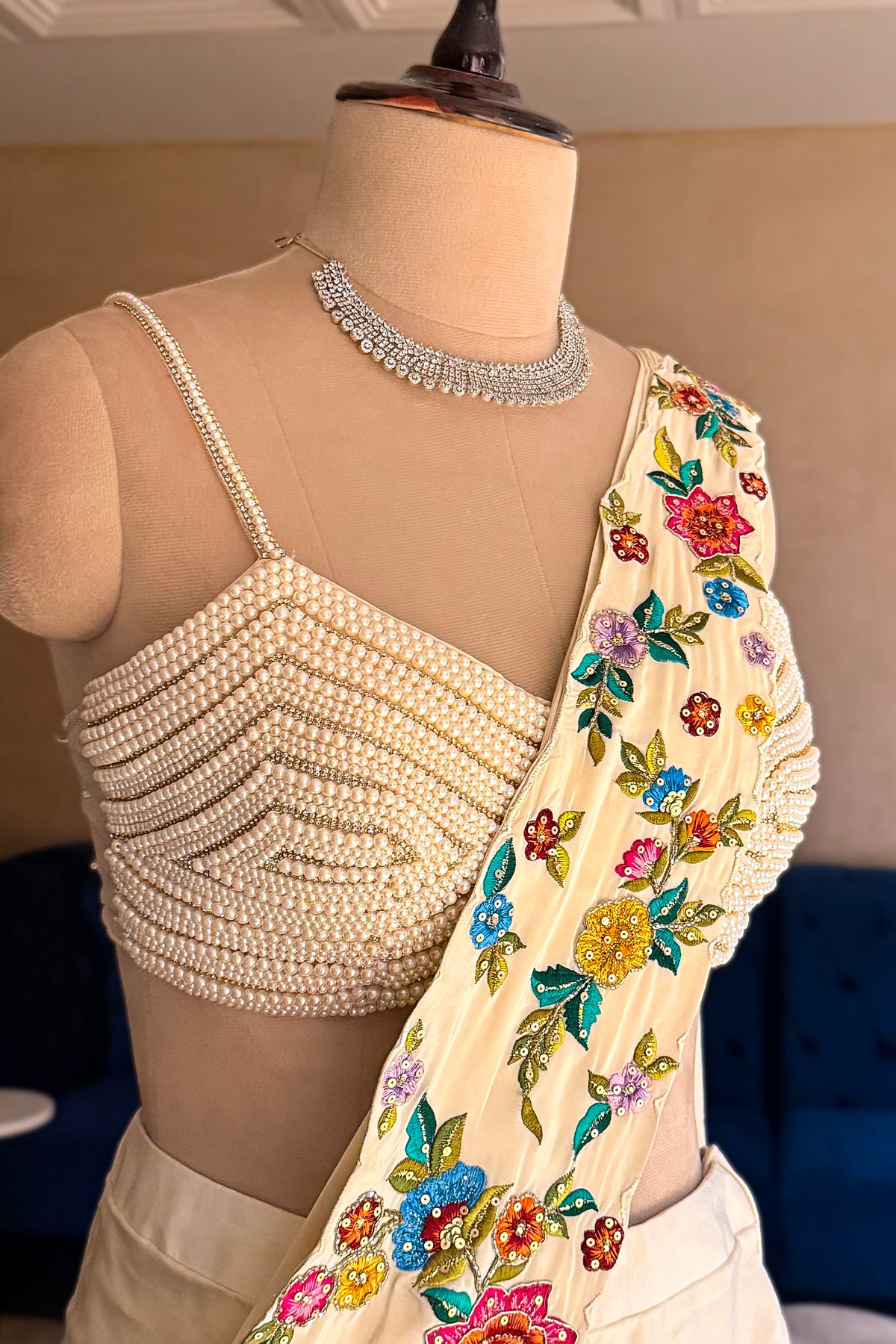 Cream Crepe Satin Silk Floral Embroidered Readymade Saree highlighting the pre-stitched seamless drape