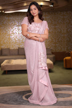 The Rose Pink Sequinned Lycra Net Cocktail Saree with Pallu Fringes and Coordinated Stitched Blouse
