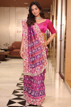 Rani Pink And Purple Silk Saree In Handcrafted Patola Weave With Intricate Bead And Mirror Work Borders