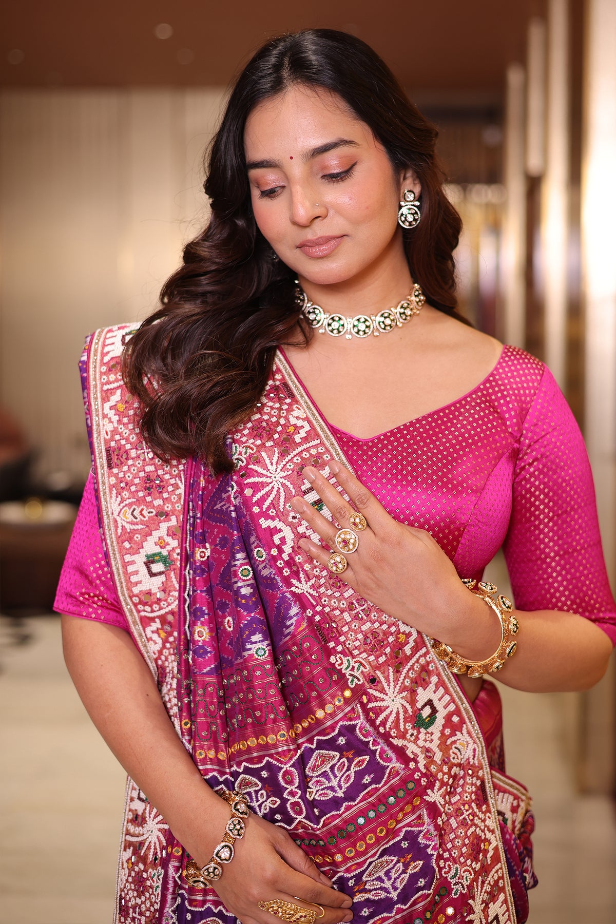 Rani Pink And Purple Silk Saree In Handcrafted Patola Weave With Intricate Bead And Mirror Work Borders