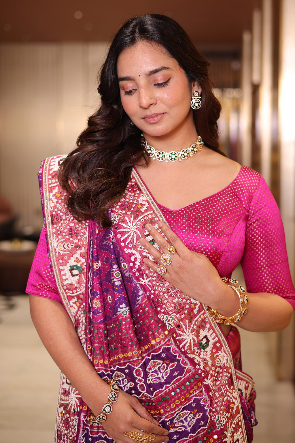 Rani Pink And Purple Silk Saree In Handcrafted Patola Weave With Intricate Bead And Mirror Work Borders