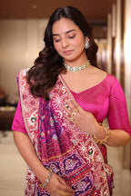 Rani Pink And Purple Silk Saree In Handcrafted Patola Weave With Intricate Bead And Mirror Work Borders