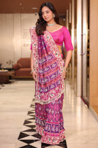 Rani Pink And Purple Silk Saree In Handcrafted Patola Weave With Intricate Bead And Mirror Work Borders