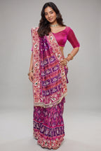 Rani Pink And Purple Silk Saree In Handcrafted Patola Weave With Intricate Bead And Mirror Work Borders