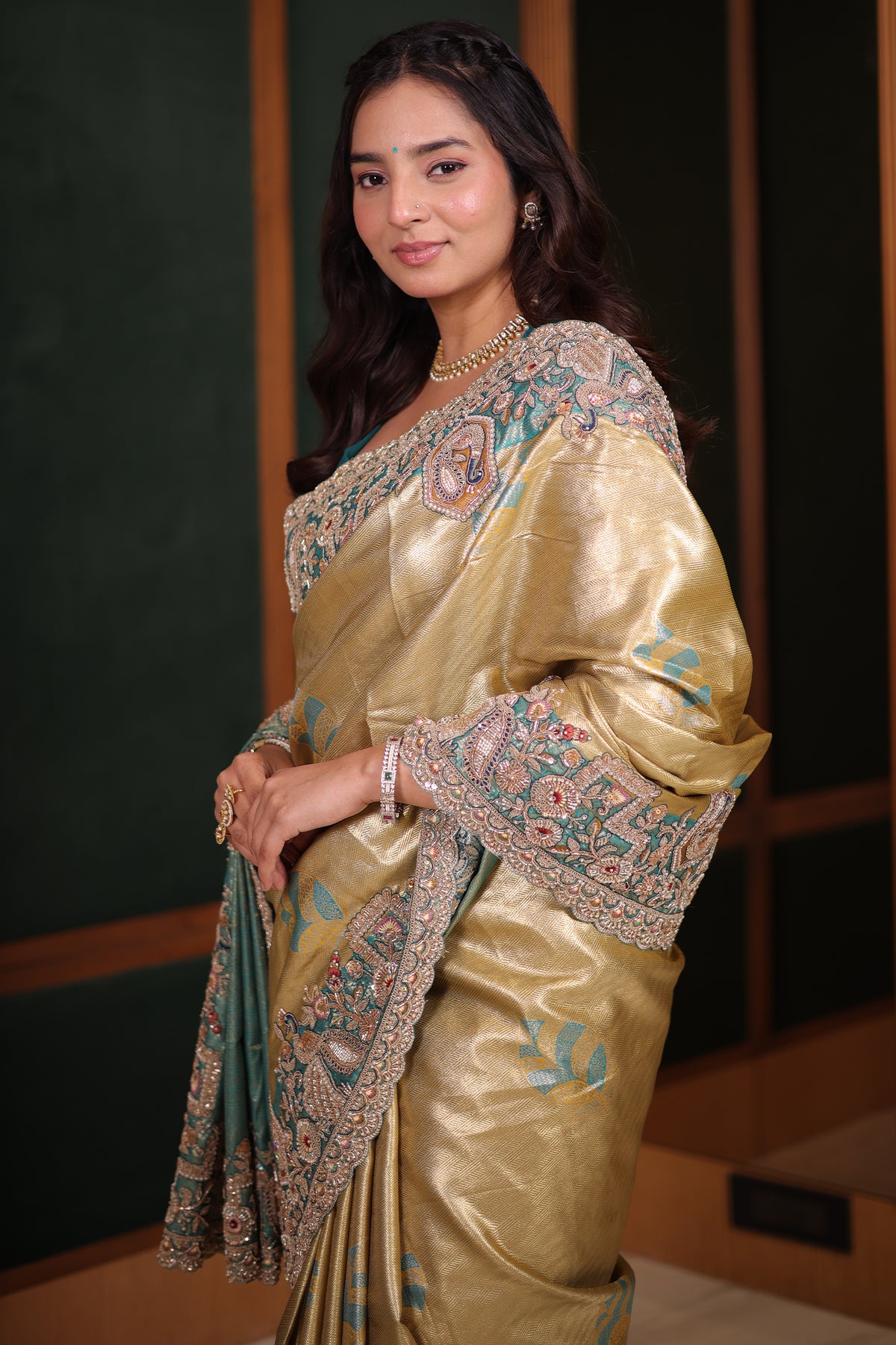 Metallic Olive Gold Tissue Weaving Saree with Contrast Sea Green Border Featuring Heavy Cutdana Bead and Embroidery
