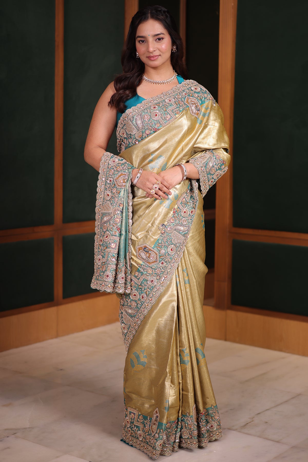 Metallic Olive Gold Tissue Weaving Saree with Contrast Sea Green Border Featuring Heavy Cutdana Bead and Embroidery