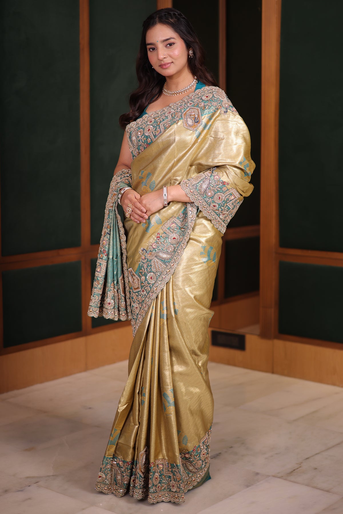 Metallic Olive Gold Tissue Weaving Saree with Contrast Sea Green Border Featuring Heavy Cutdana Bead and Embroidery