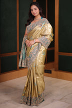 Metallic Olive Gold Tissue Weaving Saree with Contrast Sea Green Border Featuring Heavy Cutdana Bead and Embroidery
