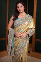 Metallic Olive Gold Tissue Weaving Saree with Contrast Sea Green Border Featuring Heavy Cutdana Bead and Embroidery