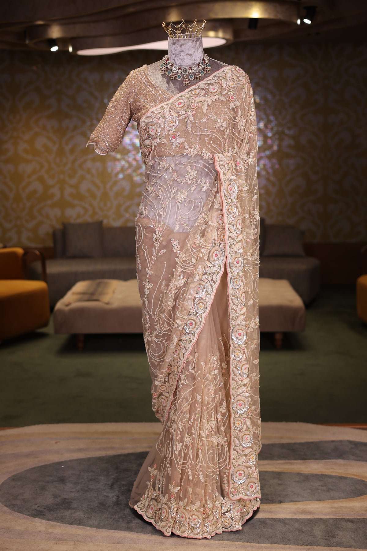 Beige Net Designer Saree Enriched With Glamorous Sequins And Cutdana Hand Embroidery