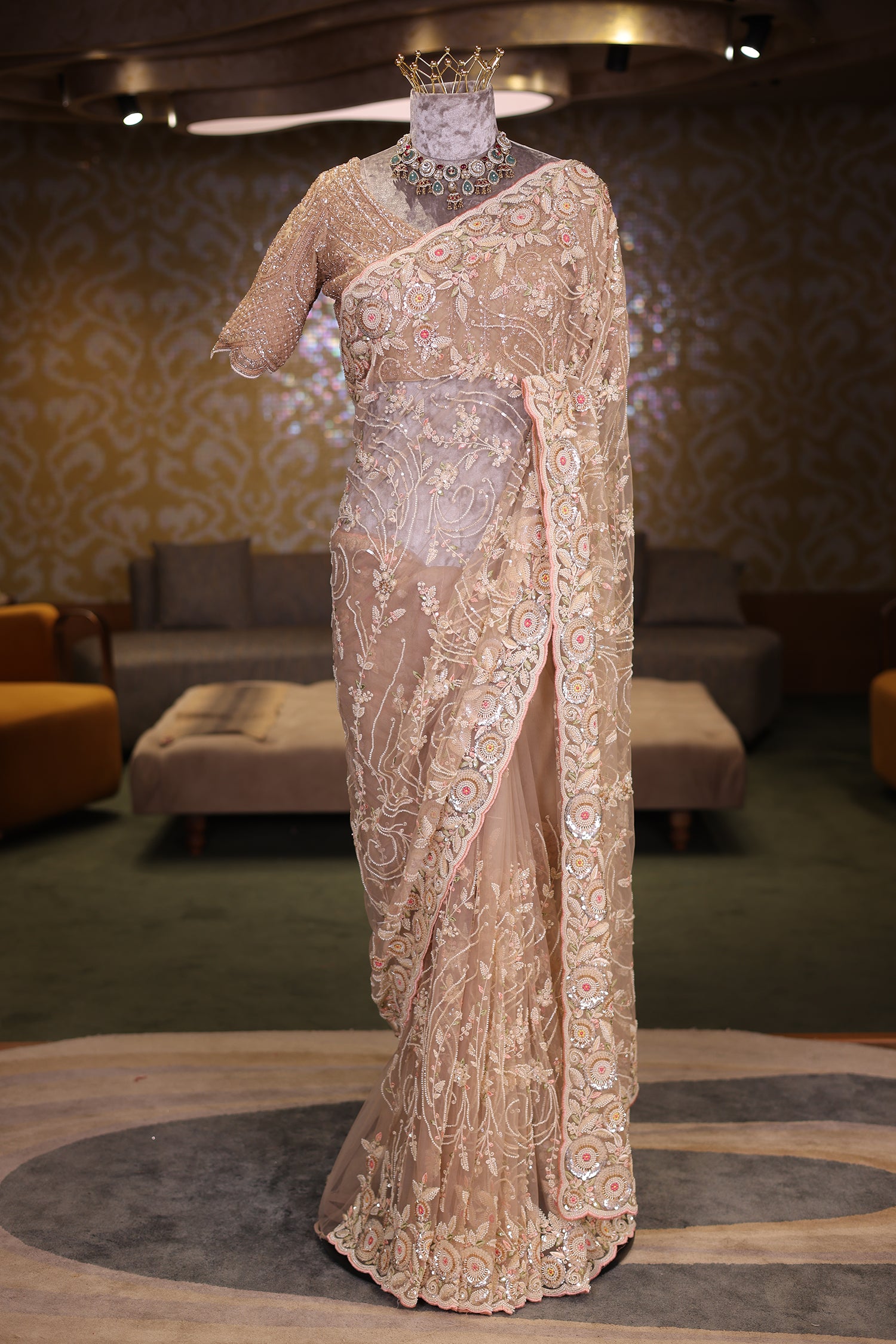 Beige Net Designer Saree Enriched With Glamorous Sequins And Cutdana Hand Embroidery