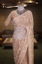 Beige Net Designer Saree Enriched With Glamorous Sequins And Cutdana Hand Embroidery