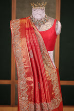 Bridal Red Metallic Kanchipuram Tissue Saree with Intricate Woven Zari and Handcrafted Zardosi and Sequin Embroidered Borders