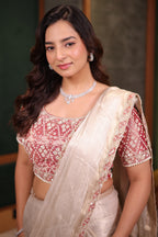 Luminous Ivory Tissue Saree with Scalloped Sequin Border and Heavy Embroidered Pink Tissue Designer Blouse
