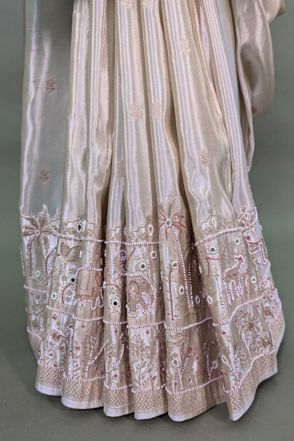 Off White Dola Silk Saree with Woven Bird and Floral Motif Bead Work Border and Pallu