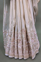 Off White Dola Silk Saree with Woven Bird and Floral Motif Bead Work Border and Pallu