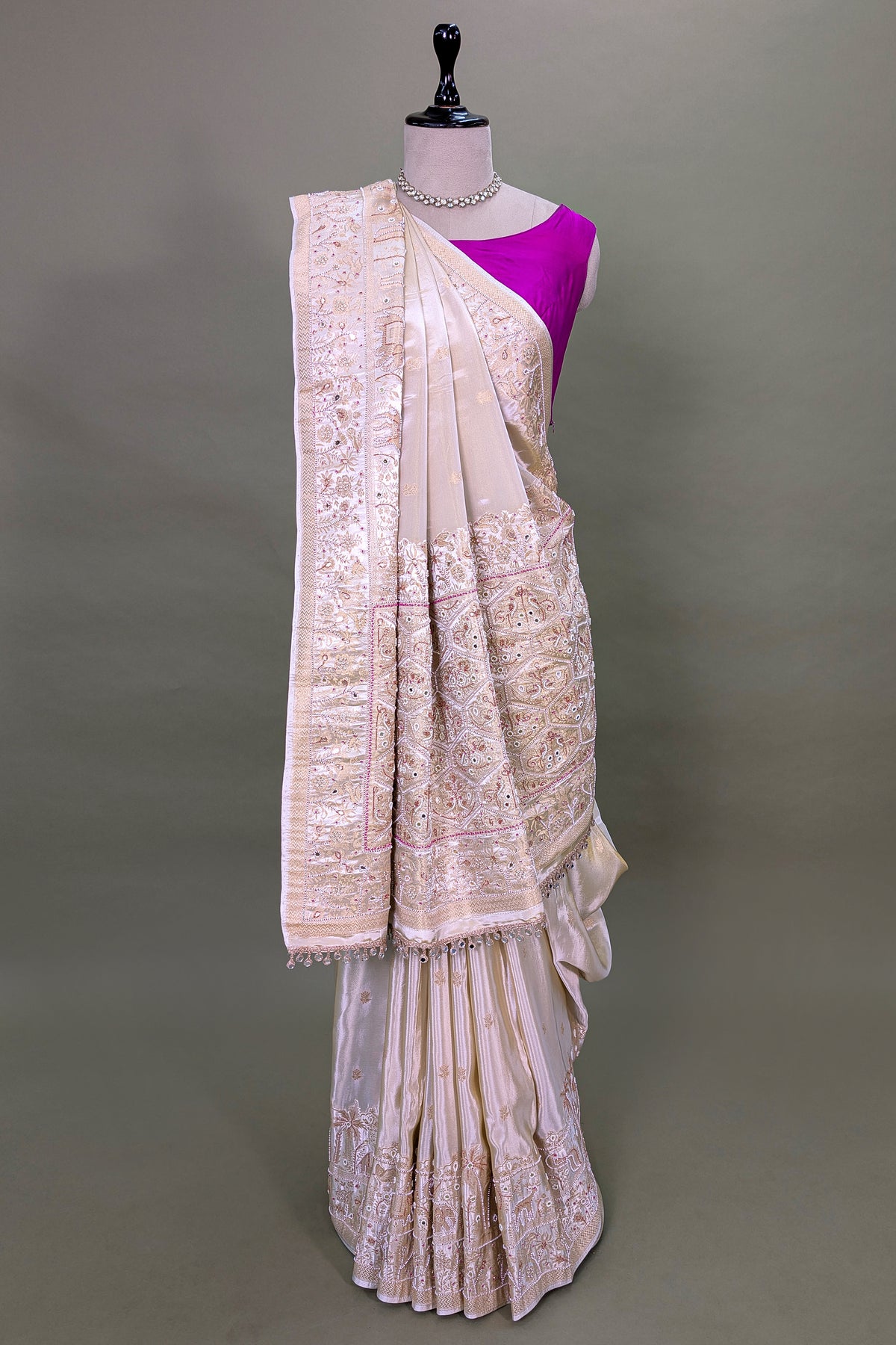Off White Dola Silk Saree with Woven Bird and Floral Motif Bead Work Border and Pallu