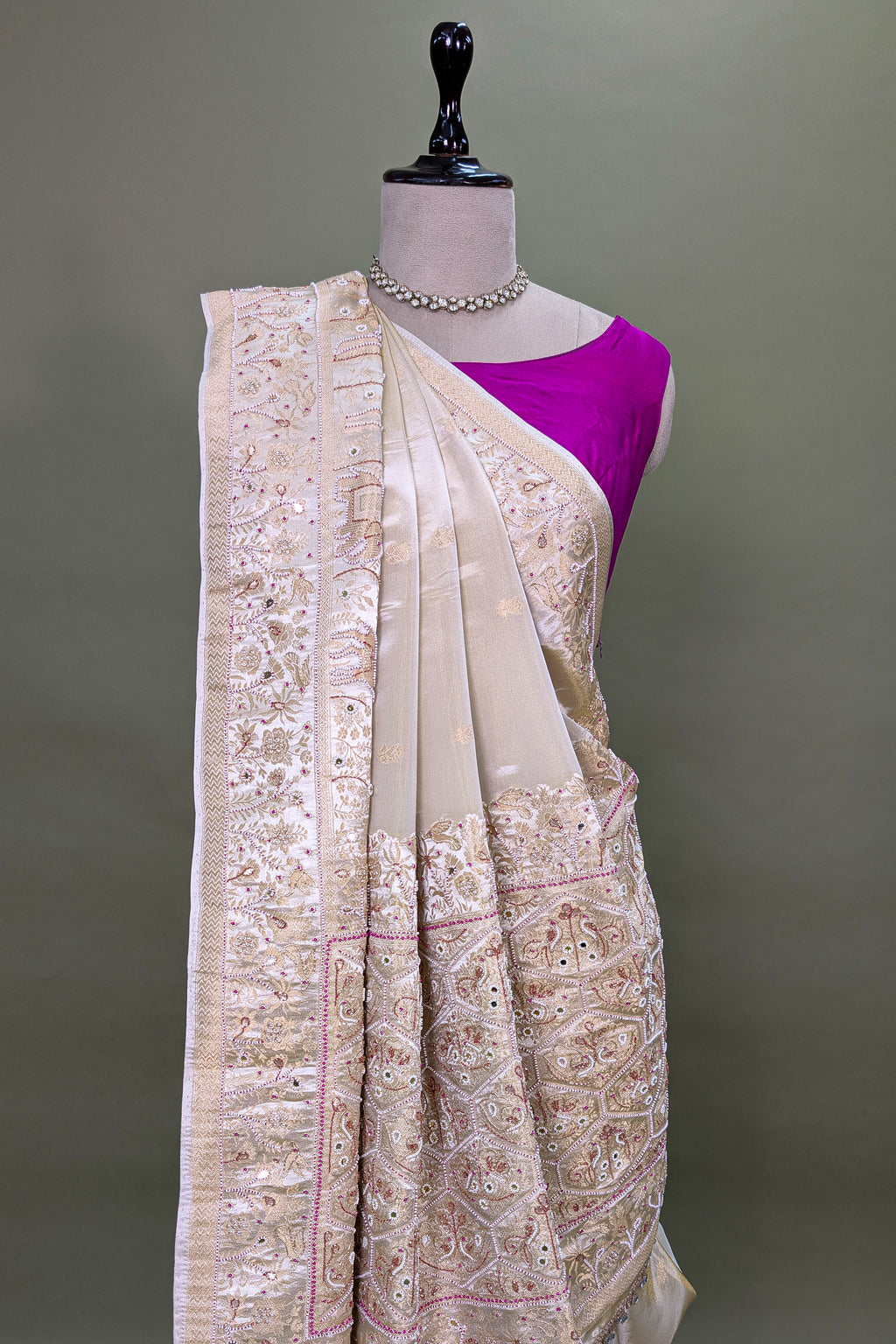 Off White Dola Silk Saree with Woven Bird and Floral Motif Bead Work Border and Pallu