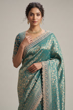 Teal Green Dola Silk Woven Saree with Heavy Work Readymade Blouse