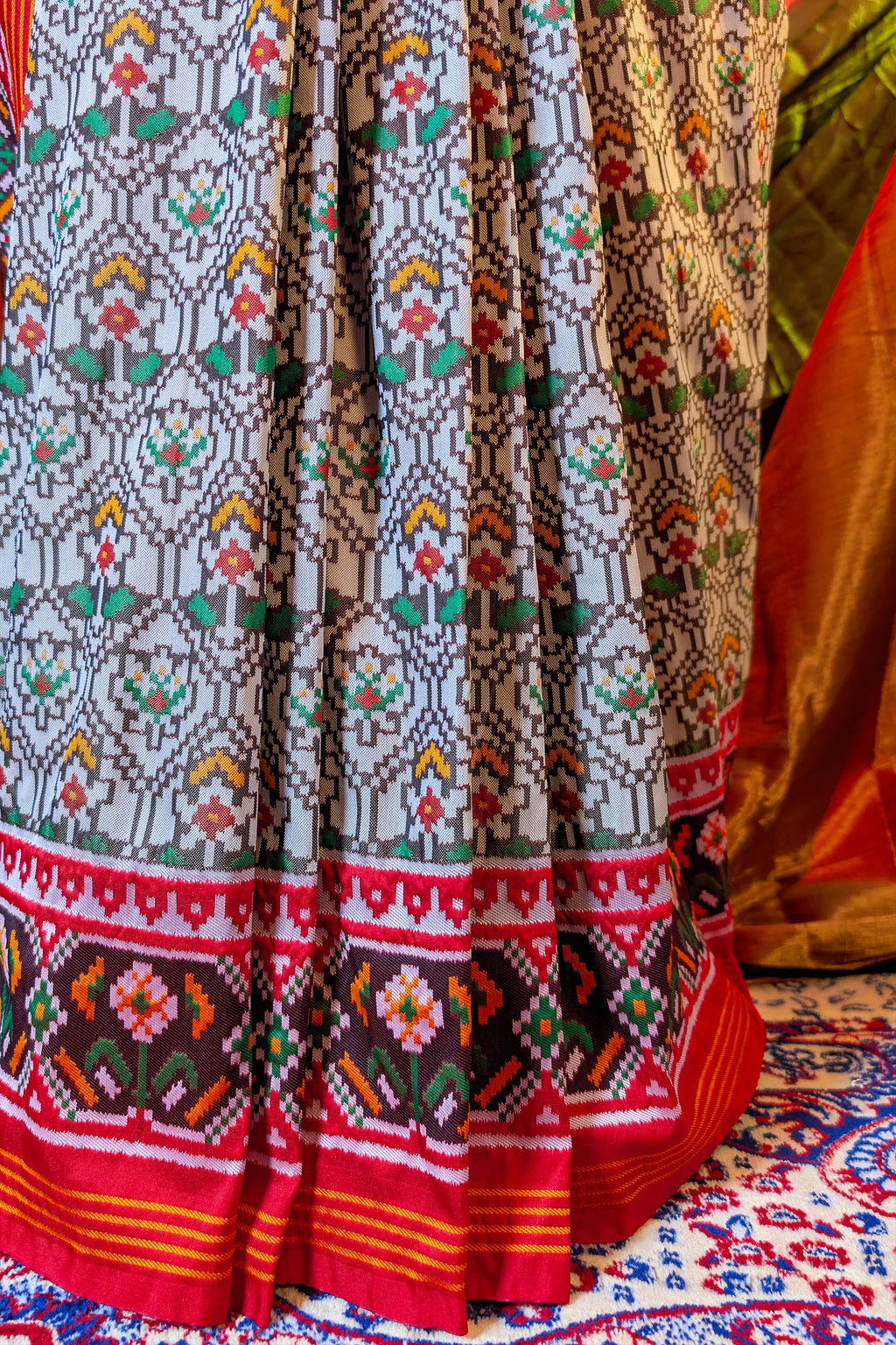 Off White Art Silk Patola Saree with Contrast Border and Pallu