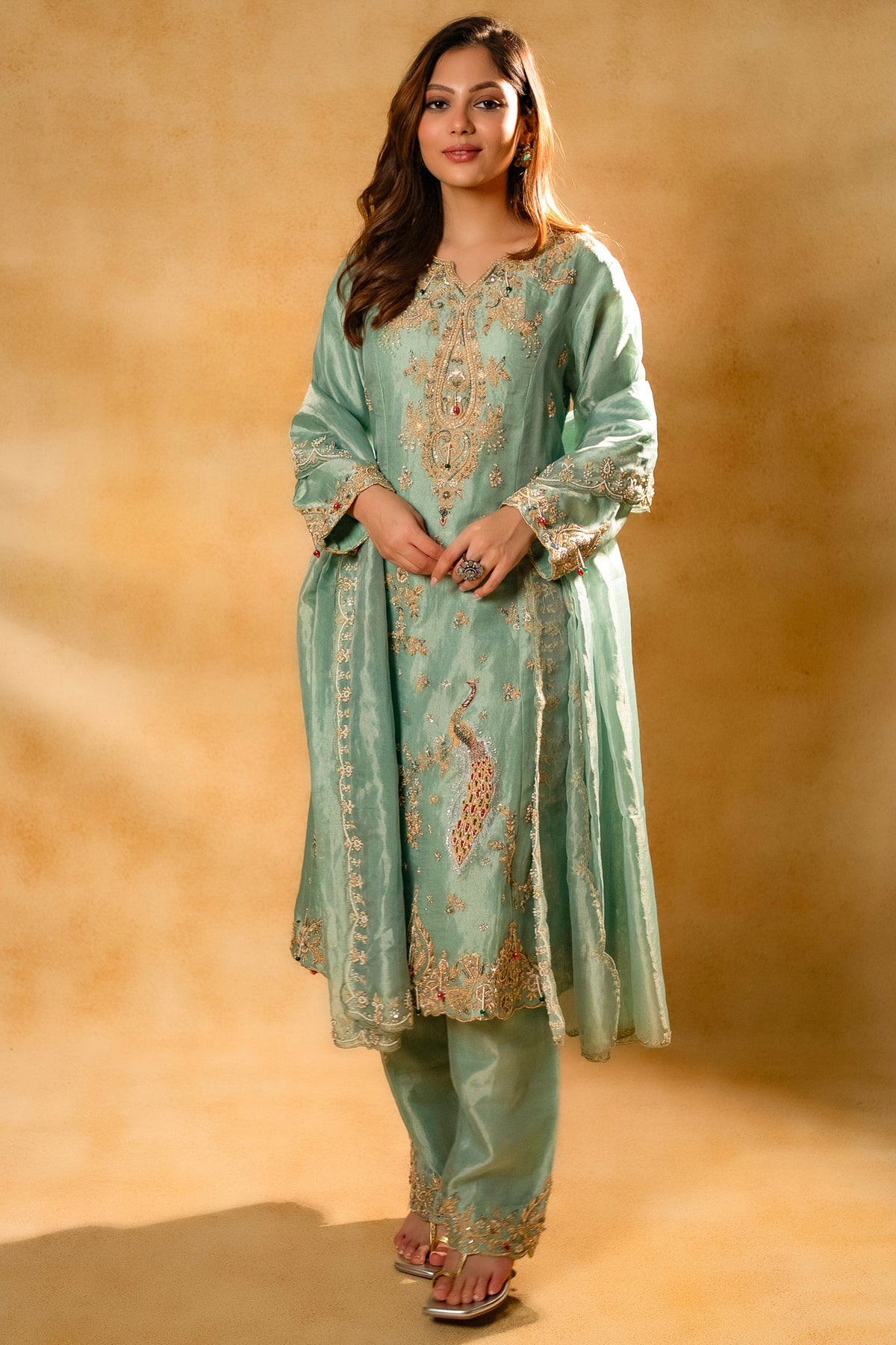 Turquoise Blue Organza Designer Handworked Suit styled with a matching organza dupatta