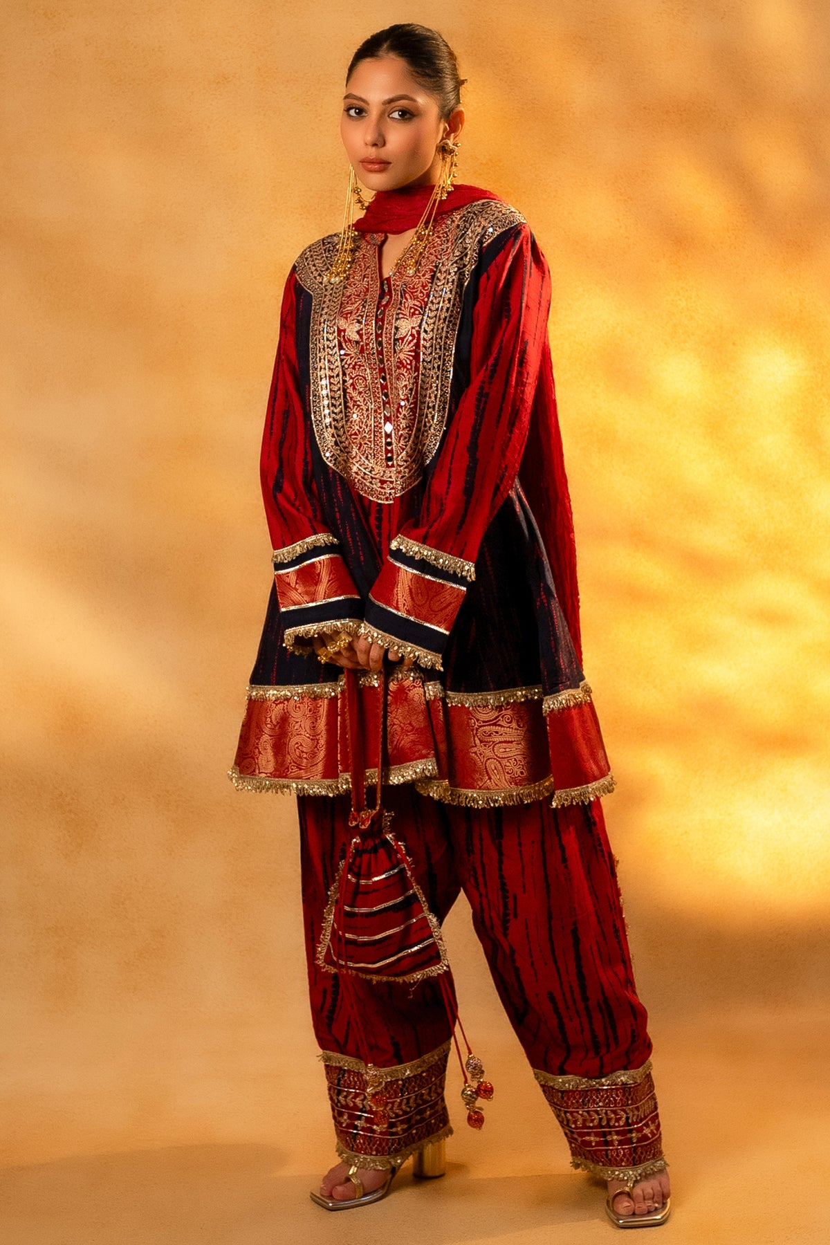 Maroon and Dark Navy Blue Raw Silk Choga Style Suit paired with a classic Patiala bottom