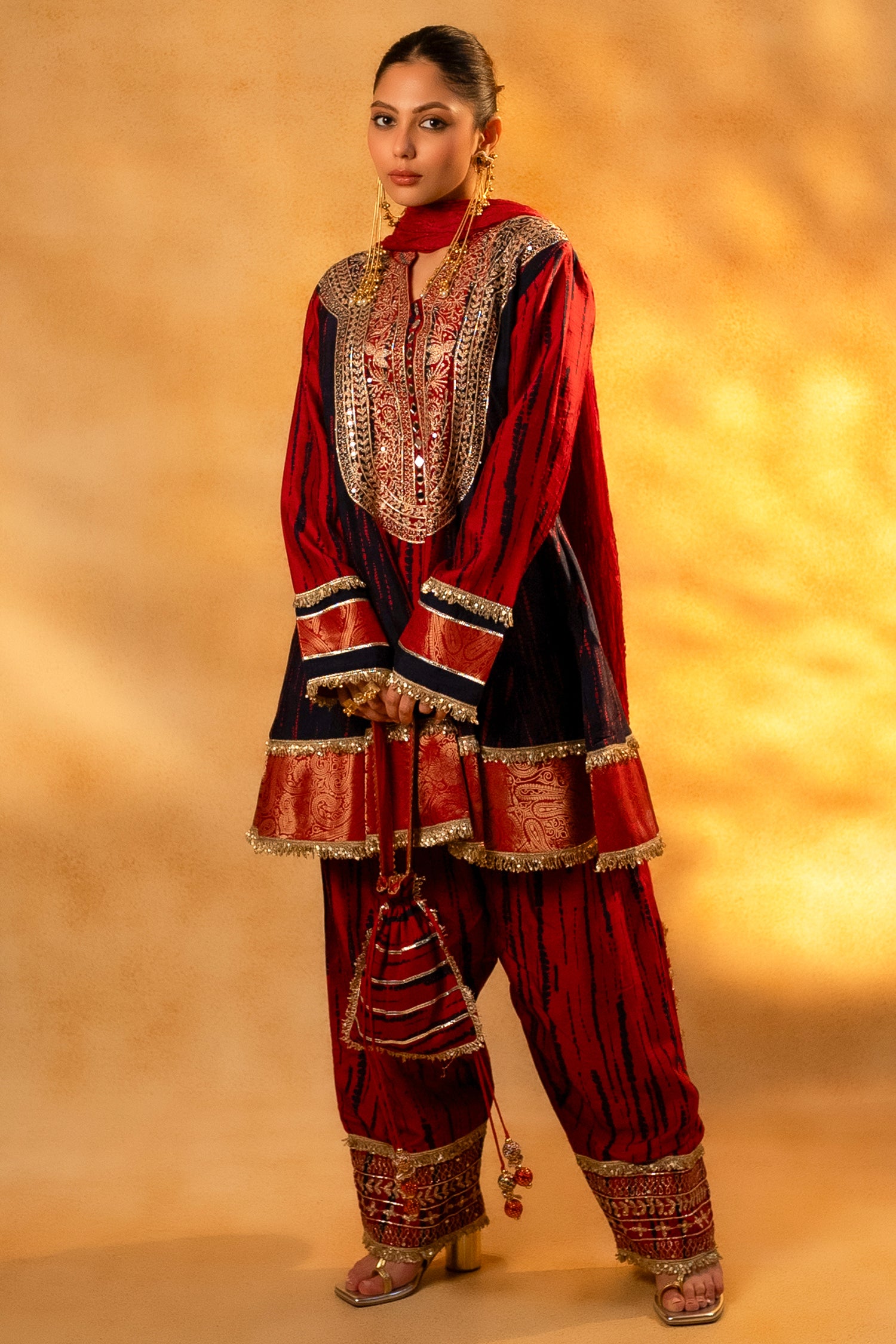 Maroon and Dark Navy Blue Raw Silk Choga Style Suit paired with a classic Patiala bottom