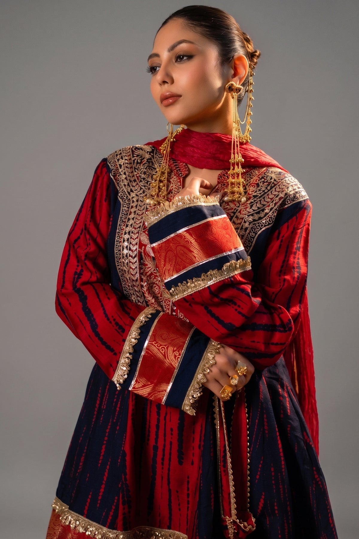 Close-up of authentic mirror work and sequins on the Maroon and Dark Navy Blue Raw Silk Choga Style Suit