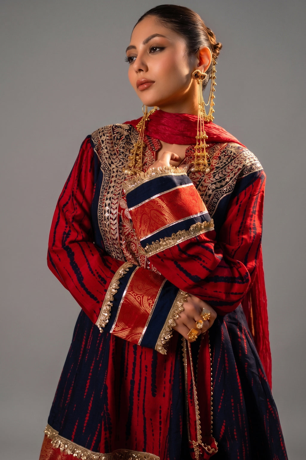 Close-up of authentic mirror work and sequins on the Maroon and Dark Navy Blue Raw Silk Choga Style Suit