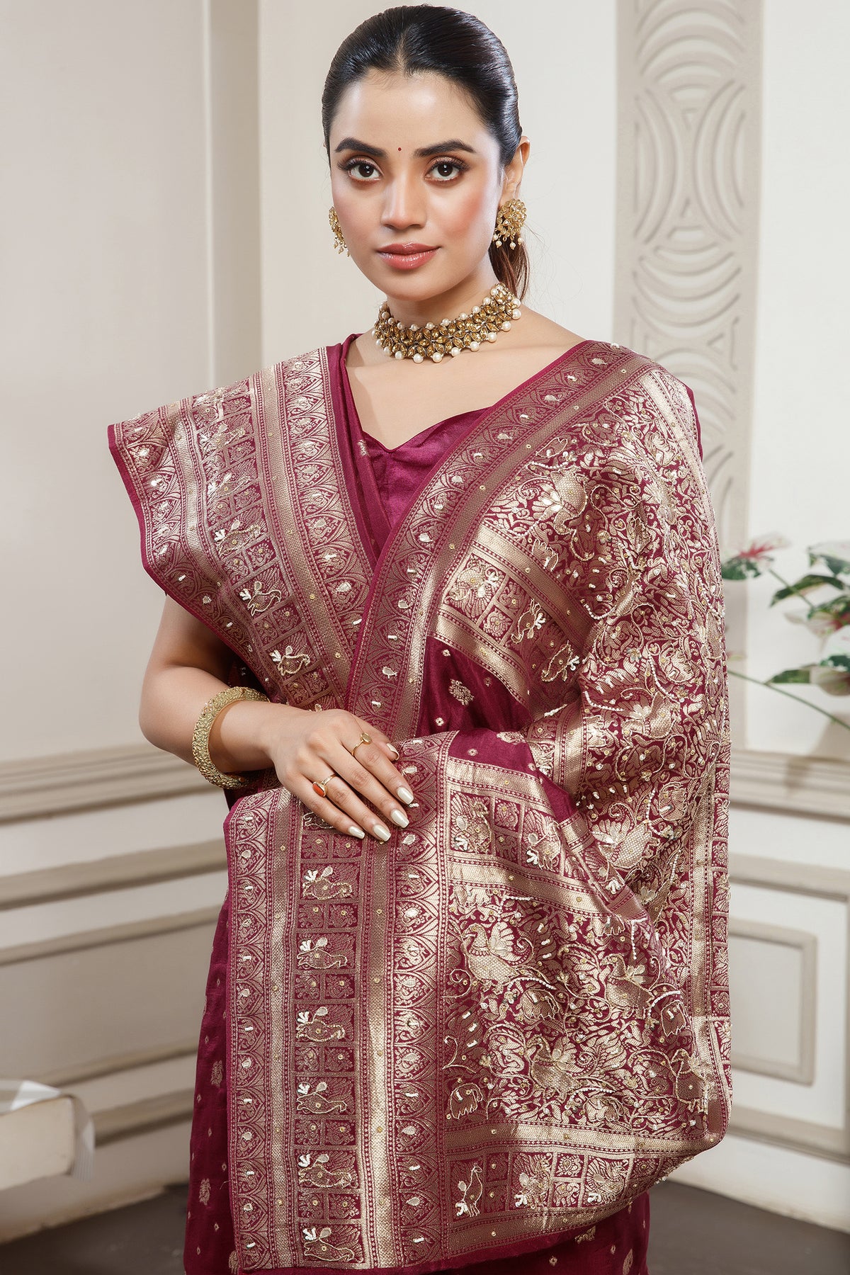 Magenta Dola Silk All Over Woven Saree styled with traditional jewelry
