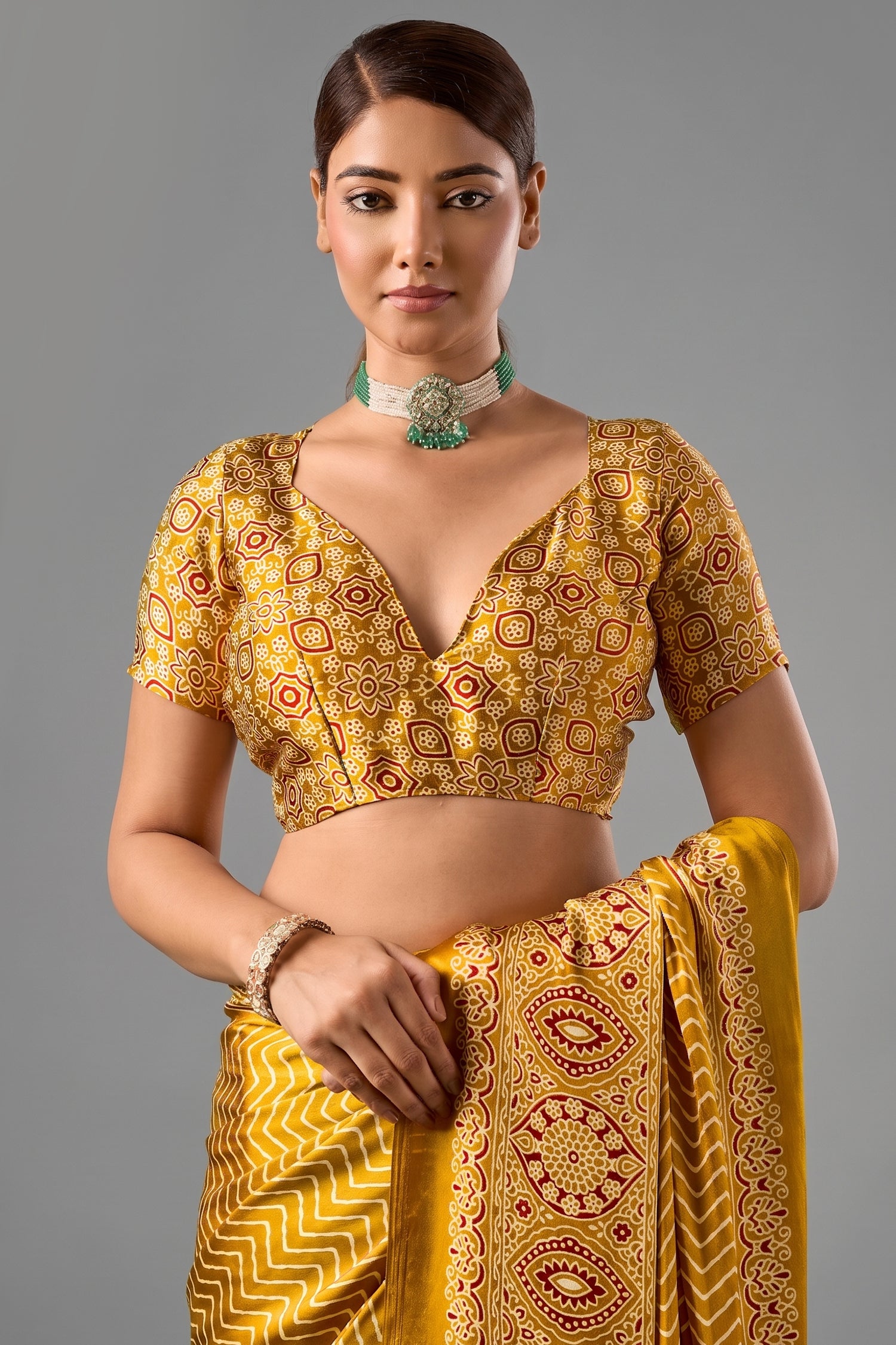 Honey Gold Satin Ajrakh Print Saree with Chevron Body and Detailed Pallu Border