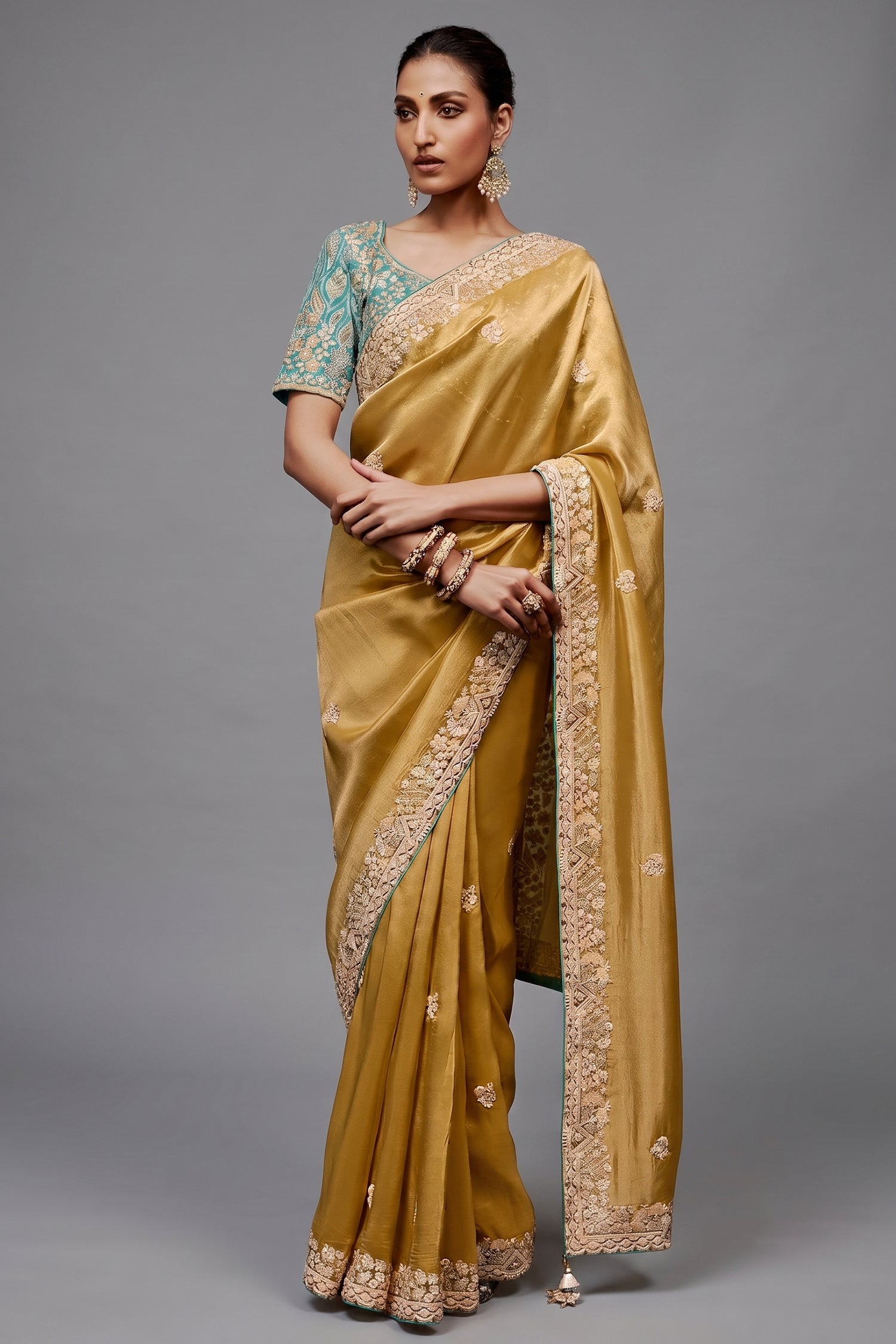 Mustard Gold Saree With Contrasting Turquoise Blue Embroidered Blouse In Cutdana Work Main image