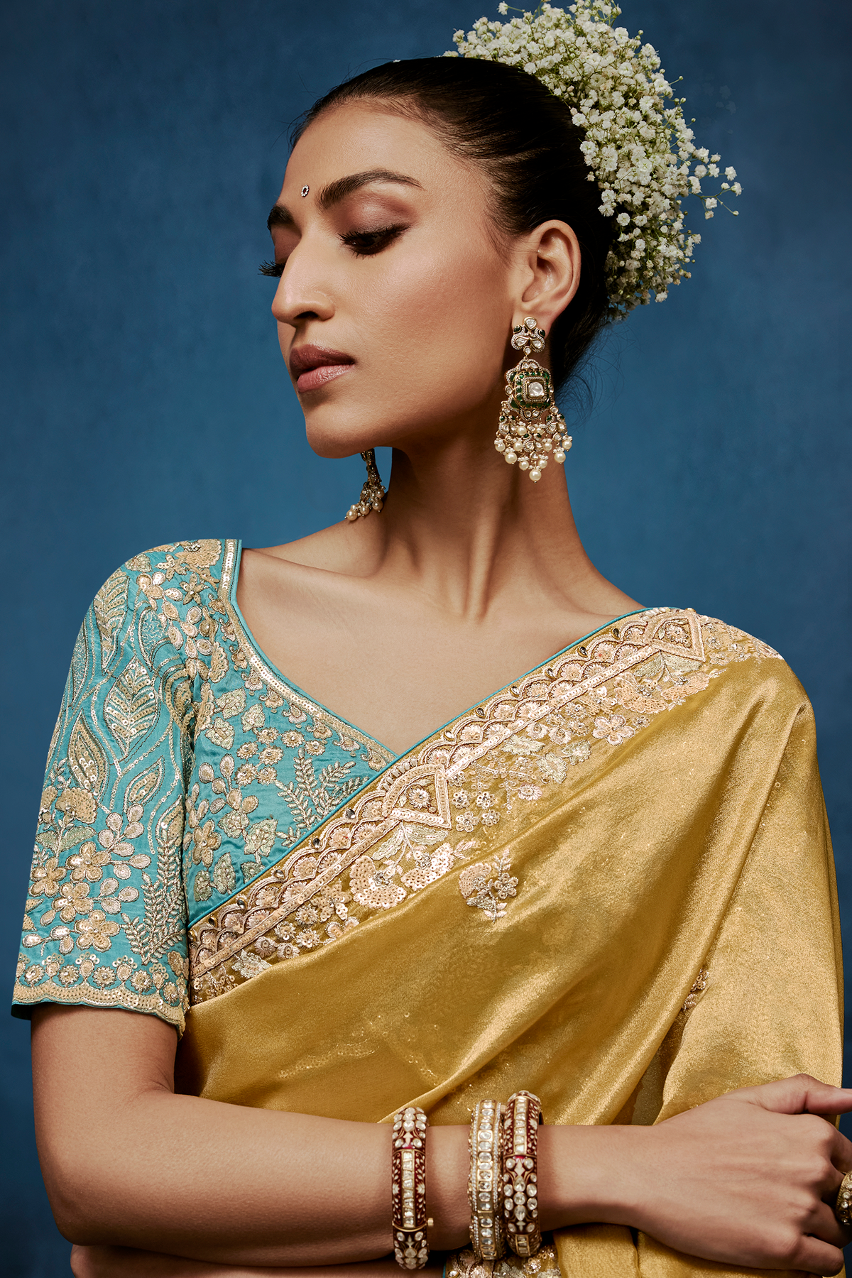 Mustard Gold Saree With Contrasting Turquoise Blue Embroidered Blouse In Cutdana Work