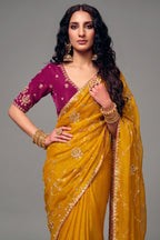 Mustard Yellow Organza Satin Saree With Heavy Sequin Embroidery And Contrasting Magenta Blouse