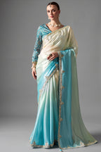 Ombre Sky Blue Tissue Saree Embellished With Sequins And Paired With A Matching Azure Print Blouse.