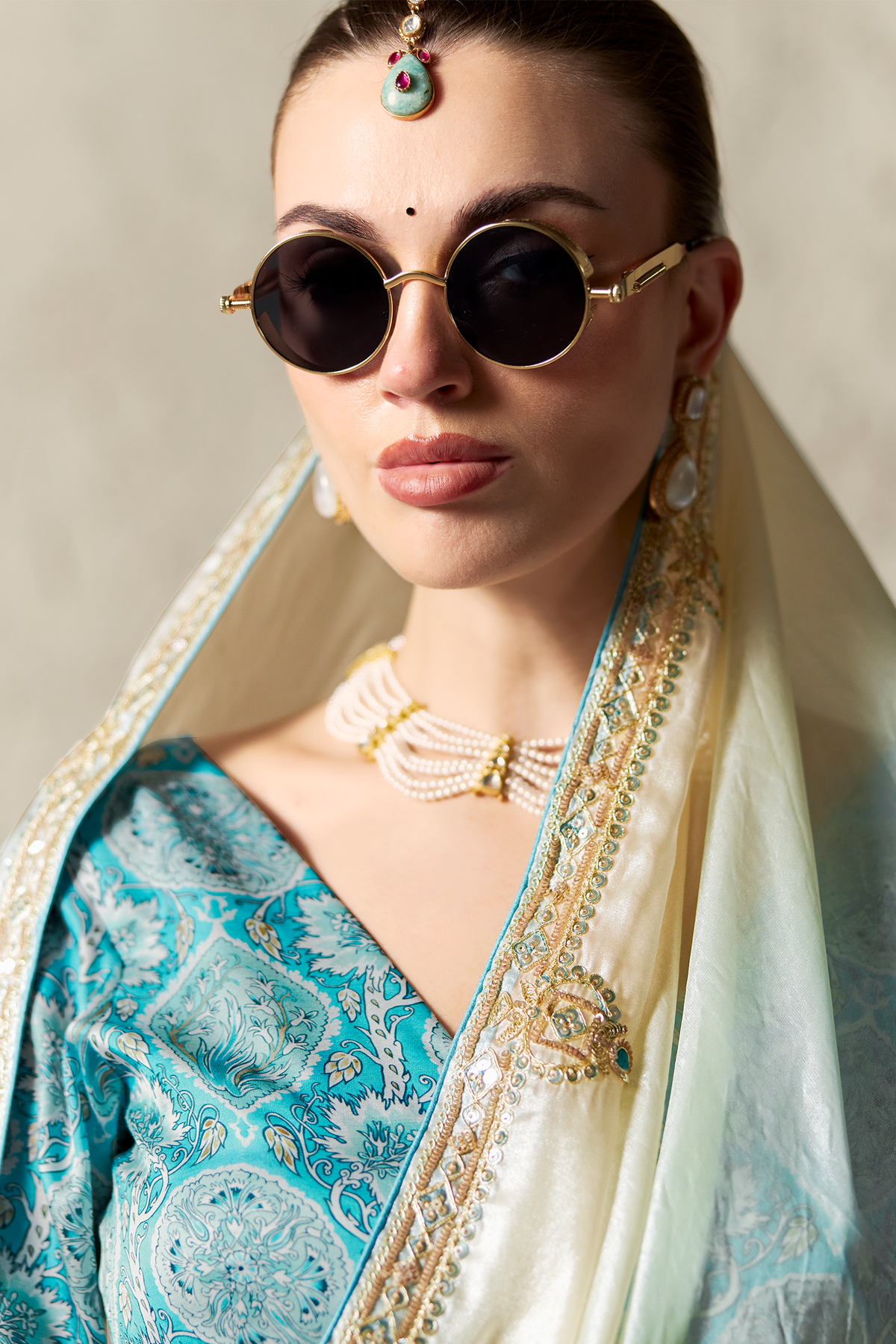 Ombre Sky Blue Tissue Saree Embellished With Sequins And Paired With A Matching Azure Print Blouse.