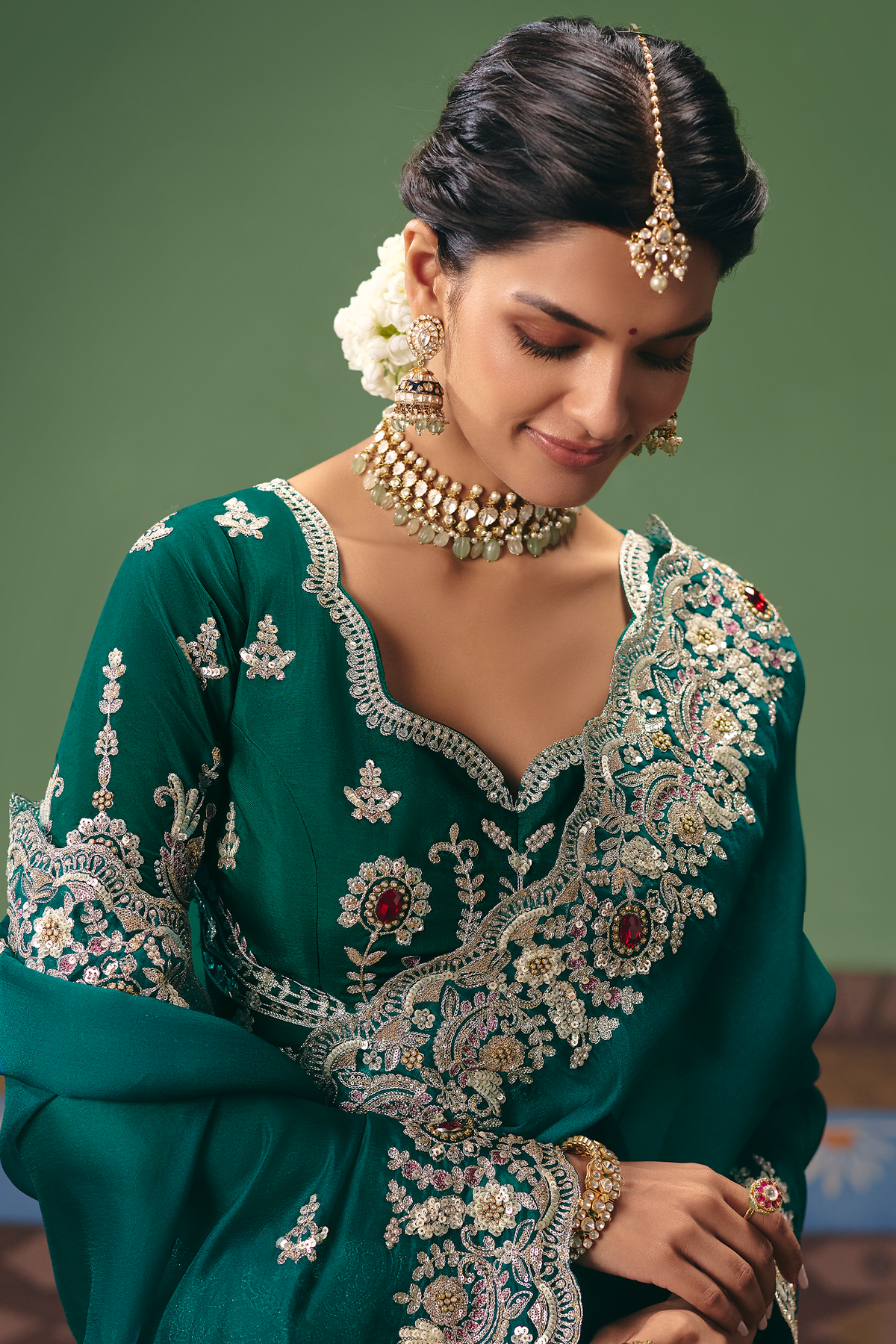 Emerald Green Silk Georgette Saree Adorned with Embroidery