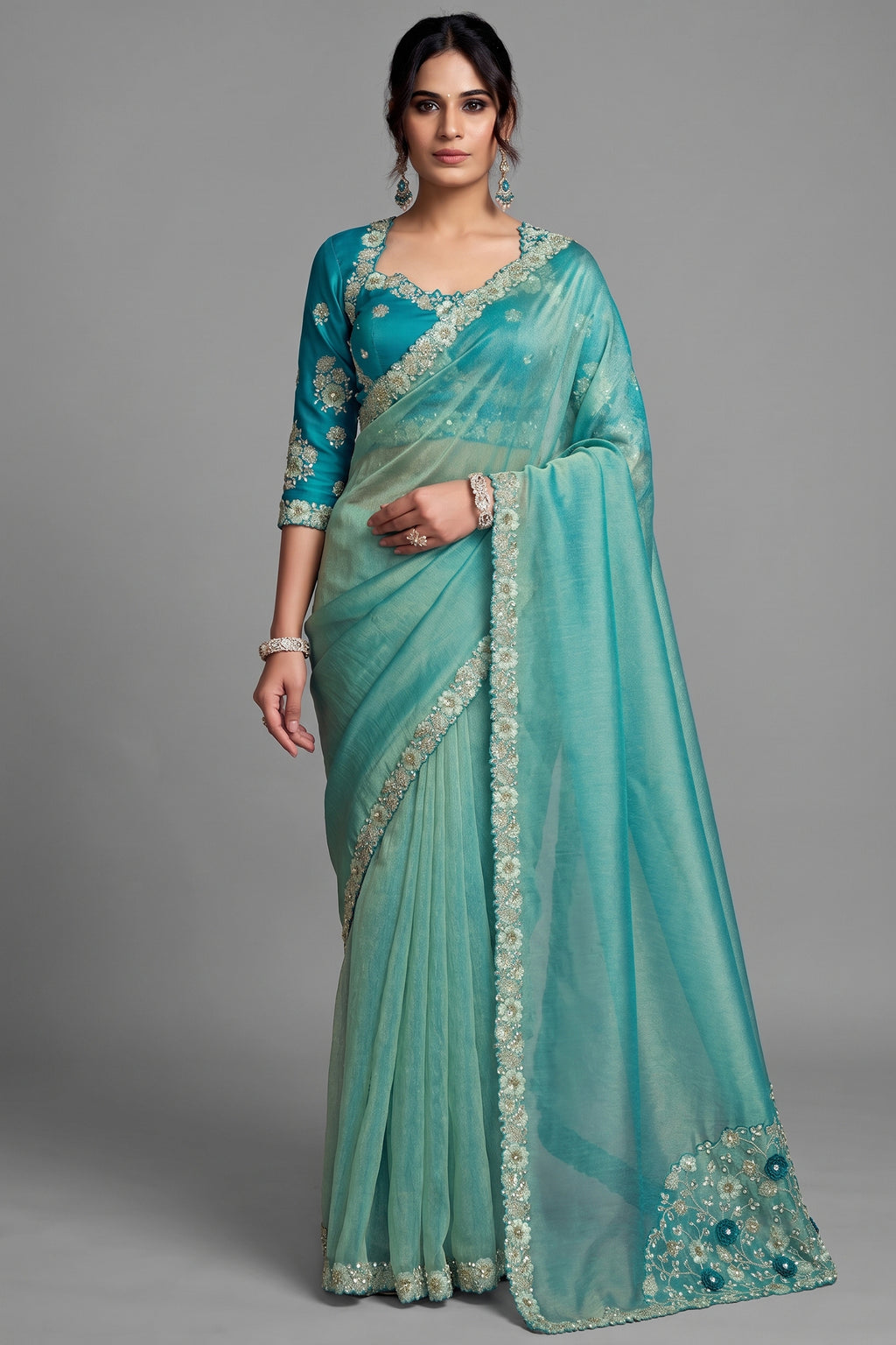 Turquoise Blue Zari Organza Satin Saree Showcasing Applique Flowers