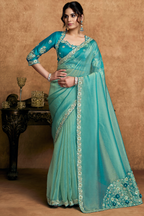 Turquoise Blue Zari Organza Satin Saree Showcasing Applique Flowers