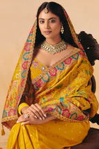 Sunkissed Yellow Dola Silk Saree Featuring A Majestic Embroidered Pallu
