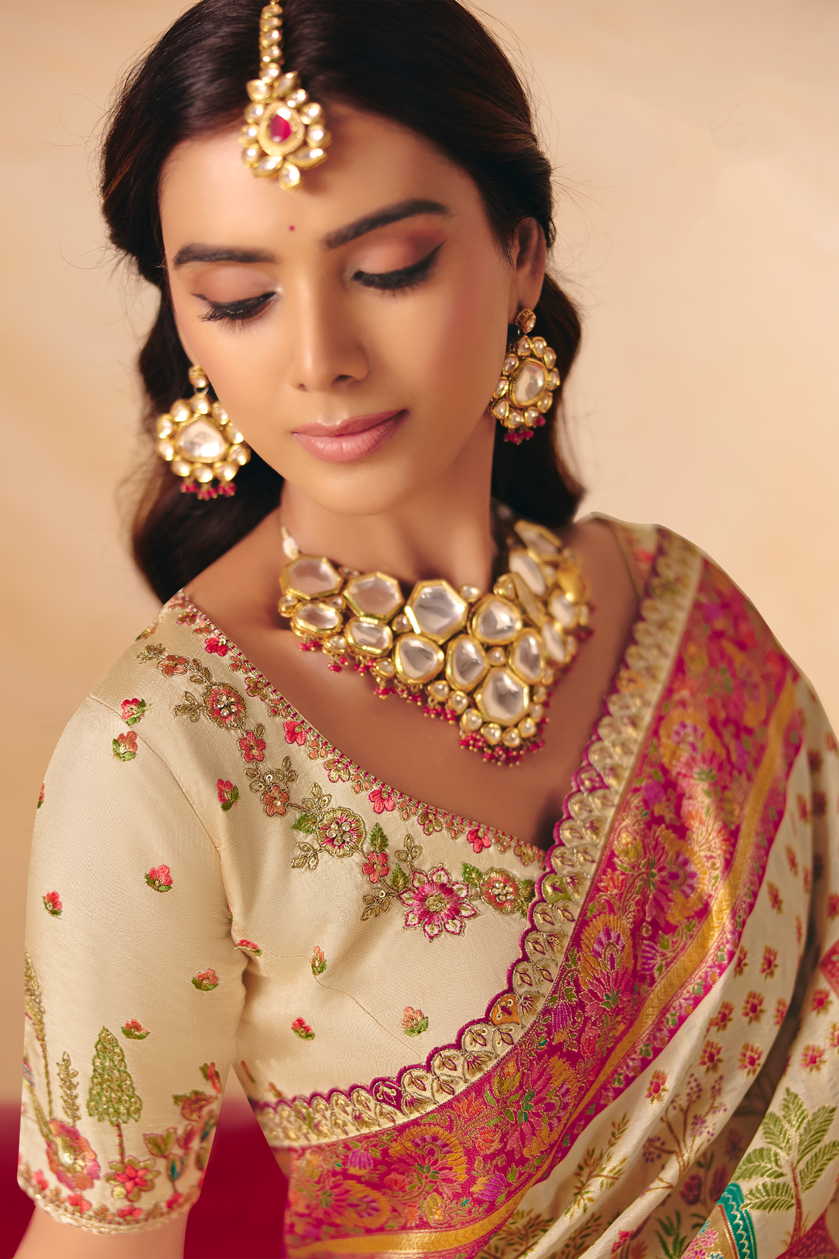 Pearl White Dola Silk Saree Accented with A Heavy Fuchsia Pink Embroidered Pallu