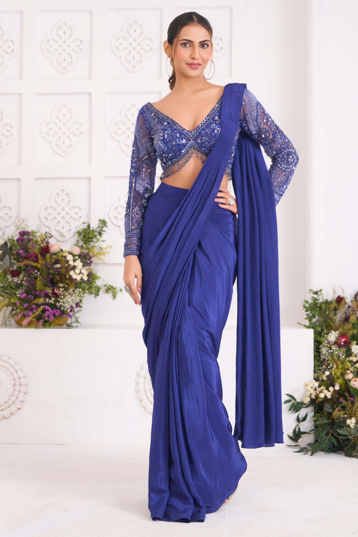 Indigo Blue Crepe Silk Pre-Draped Saree featuring Heavily Hand-Embellished V-Neck Full Sleeve Blouse